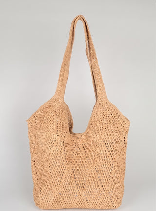 Cómo combinar bolsos de rafia: el accesorio estrella del verano